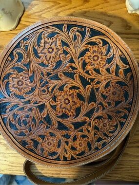 Myra Bag Round Tooled Leather Crossbody in Brown and Black
